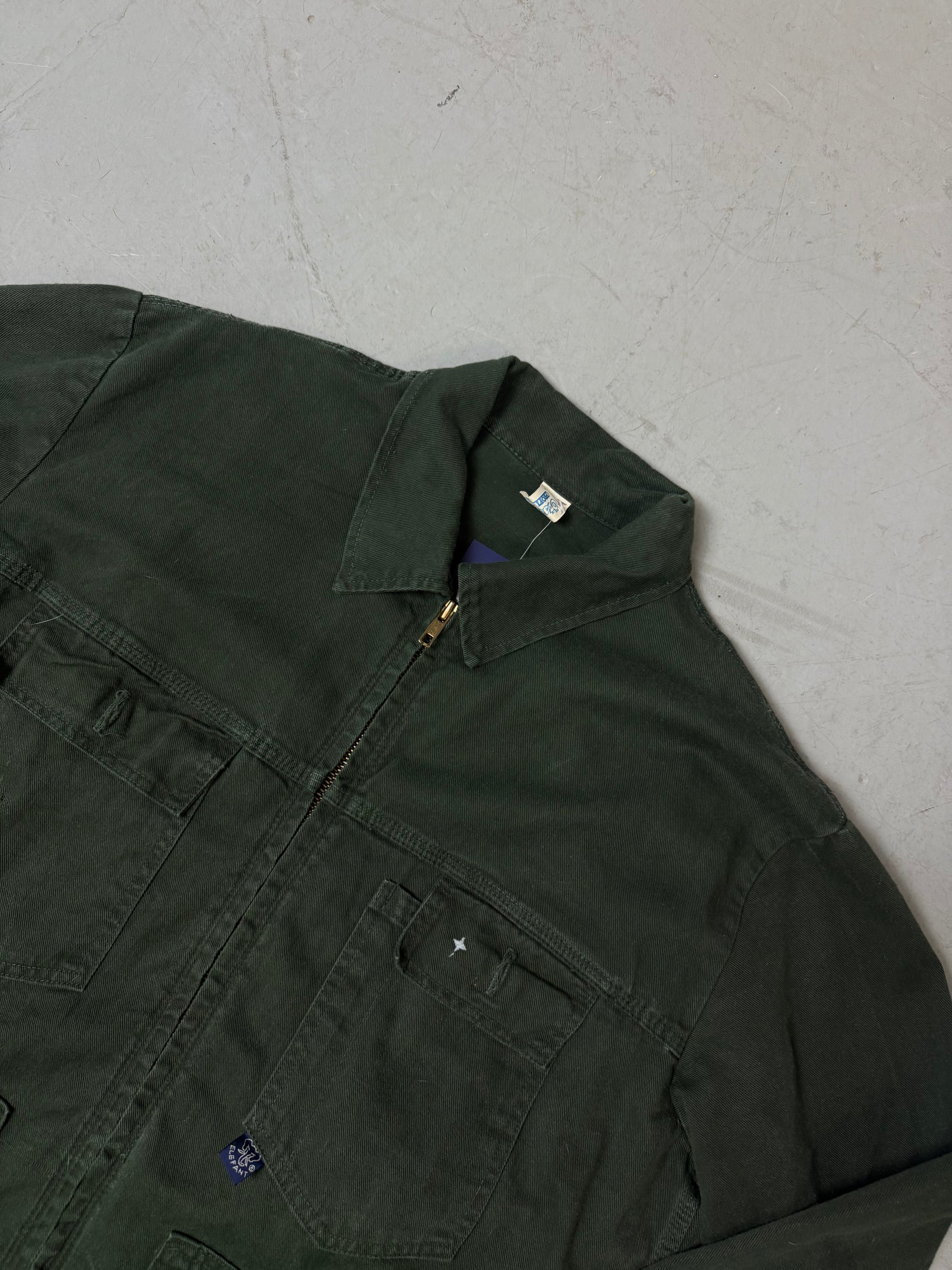 Eine grüne übergangsjacke mit Farbfleck im used workwear Look in L