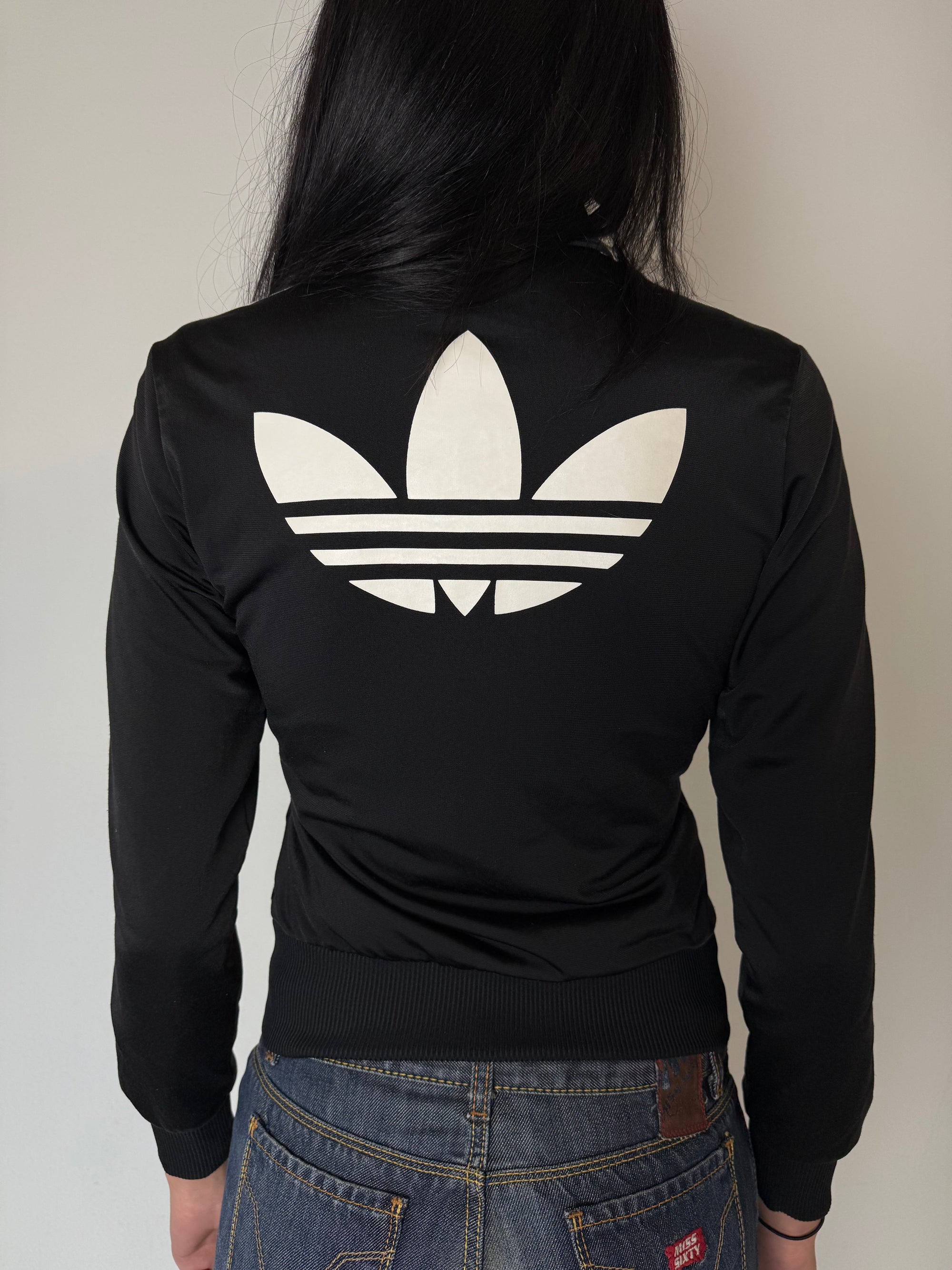 Eine schwarze Adidas Firebird Track Jacke mit weißen Streifen XS 