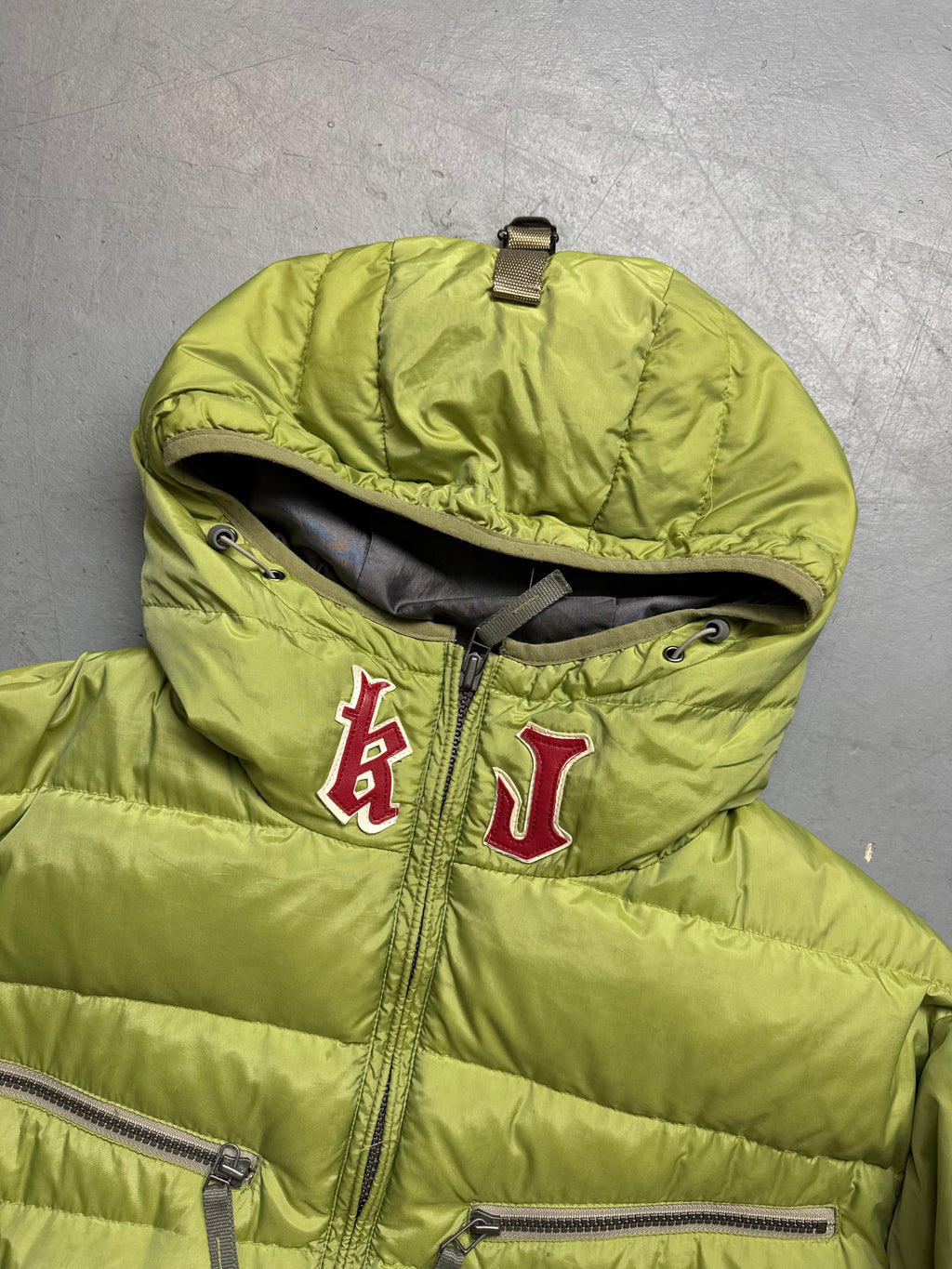 Vintage Kejo Green Patched Puffer Jacket with red details for men’s. Y2K Second Hand 2000s Fashion 