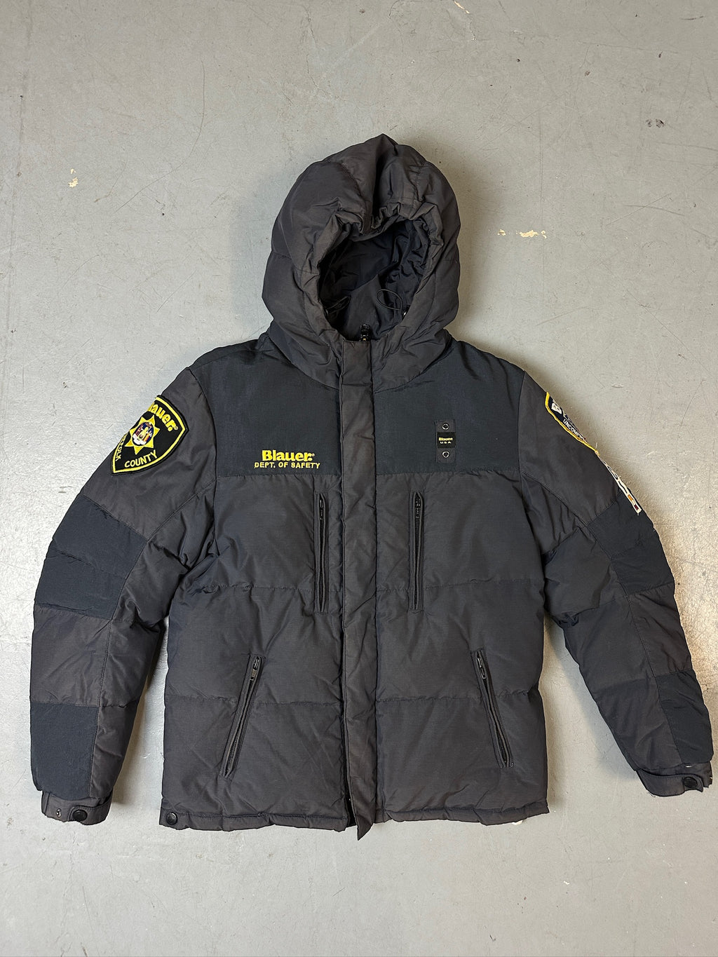 Produktbild von Grauer Blauer Daunen Jacke in L für grauem Boden