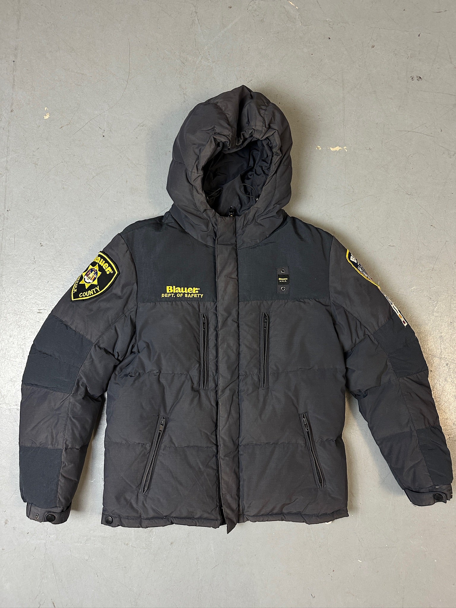 Produktbild von Grauer Blauer Daunen Jacke in L für grauem Boden