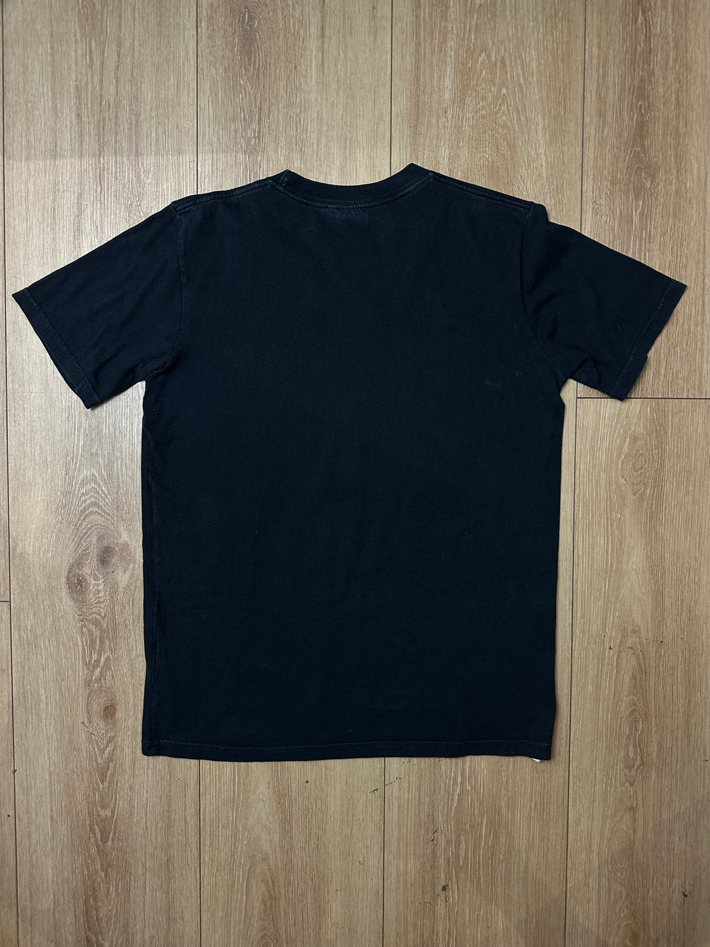 Produktbild von einem Vintage Black Carhartt Tee von hinten
