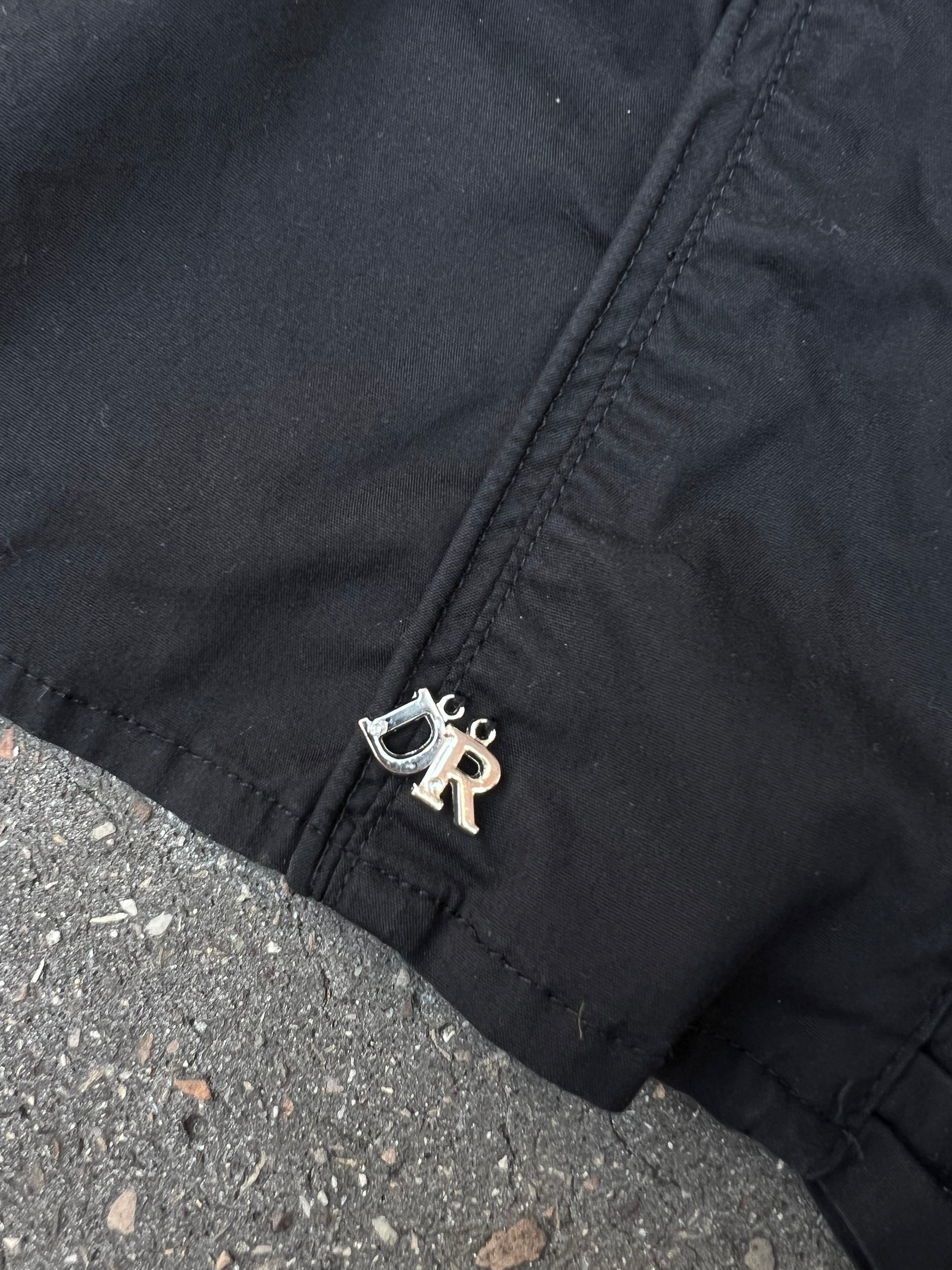 Eine schwarze Bluse von Diego Reiga in S mit Rüschen