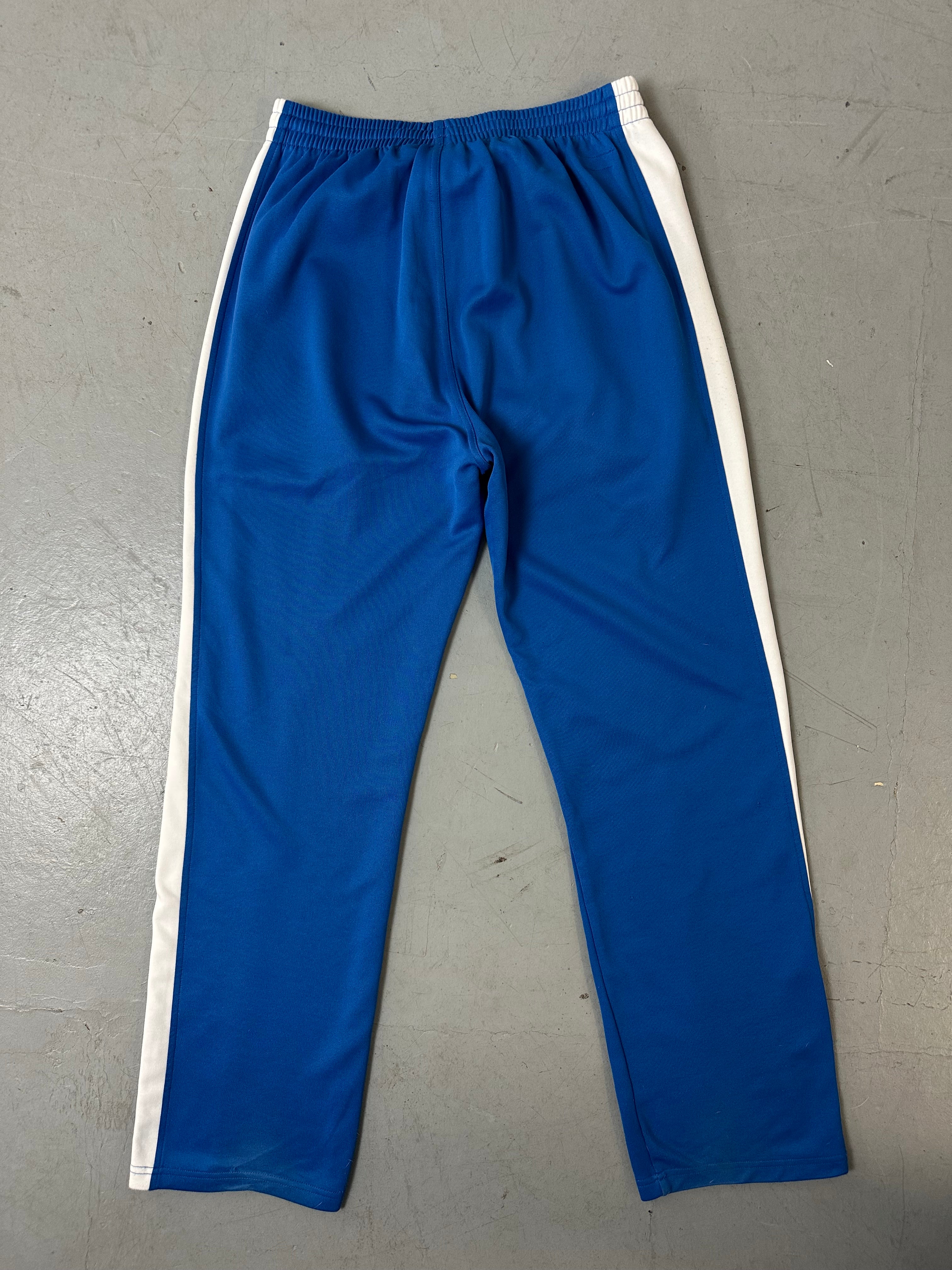 Ein Blau weißes Set von Puma bestehend aus Trackjacke und Trackpants in M/L