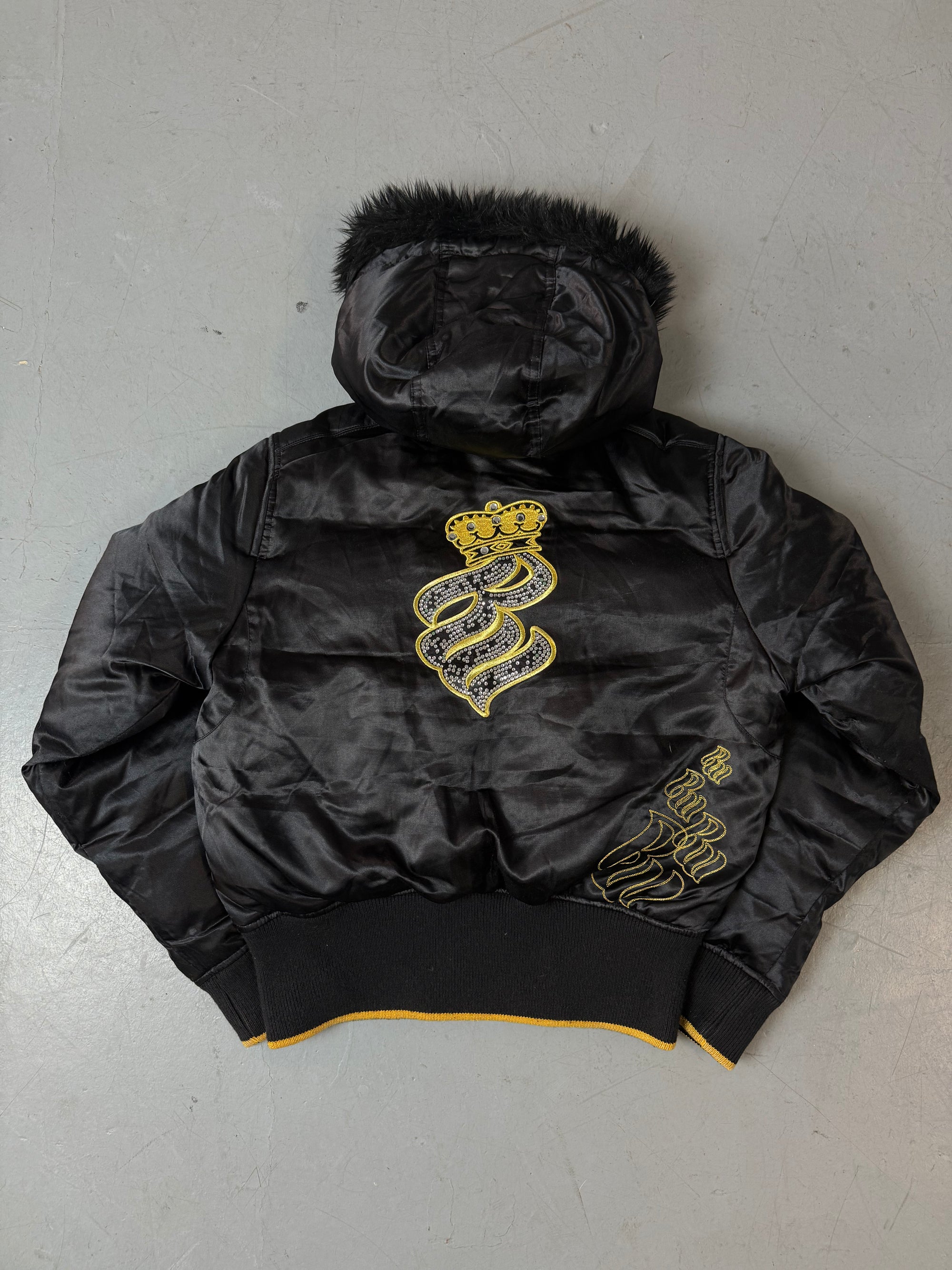 Eine schwarz golde Winterjacke von Rocawear mit Gold Details und fur hood 