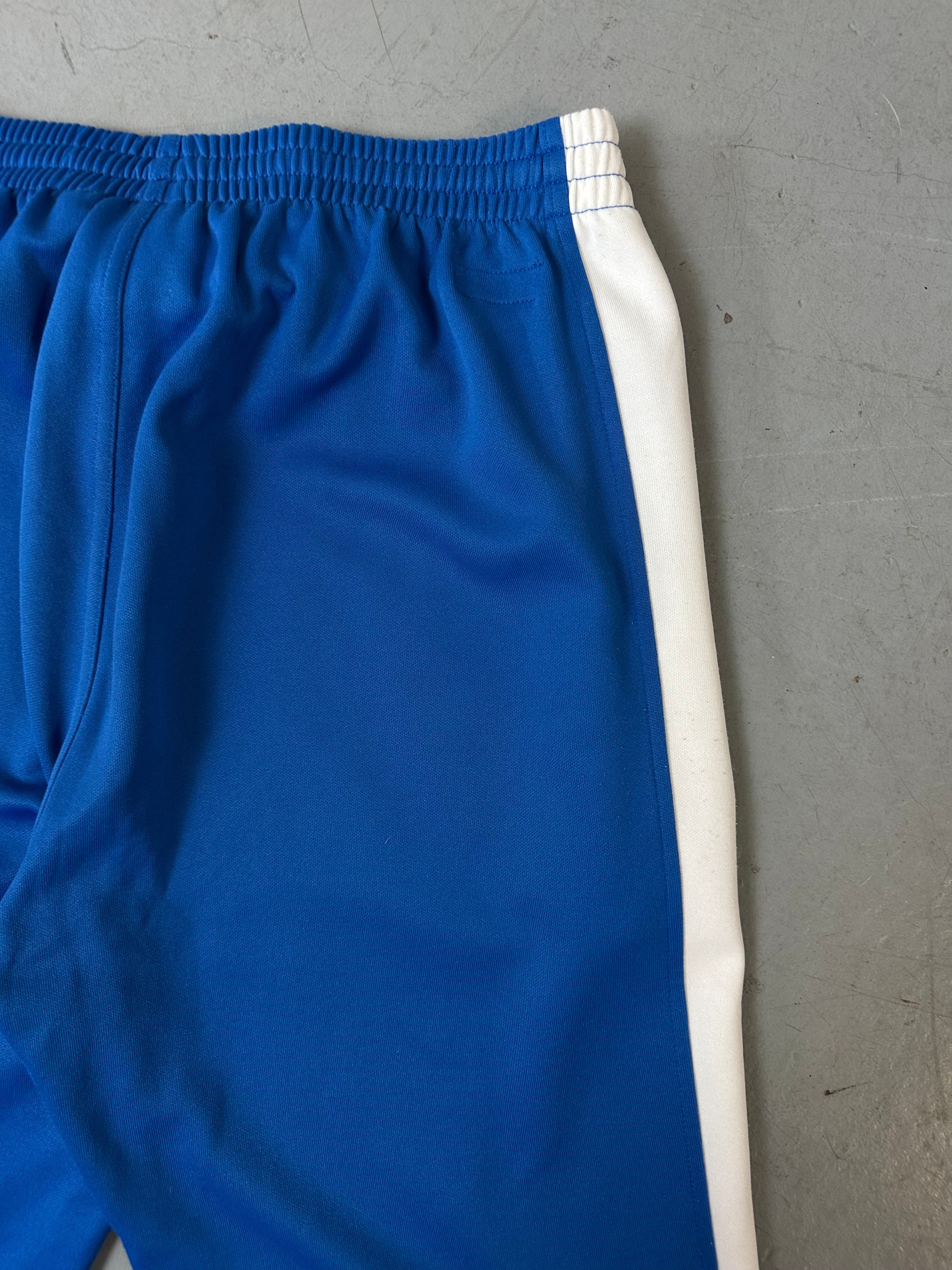 Ein Blau weißes Set von Puma bestehend aus Trackjacke und Trackpants in M/L