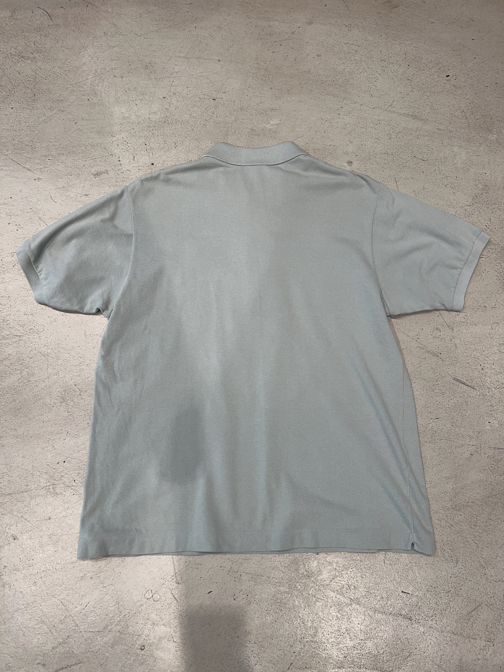 Vintage Lacoste Poloshirt für Herren. Y2K Second Hand 2000s Fashion.