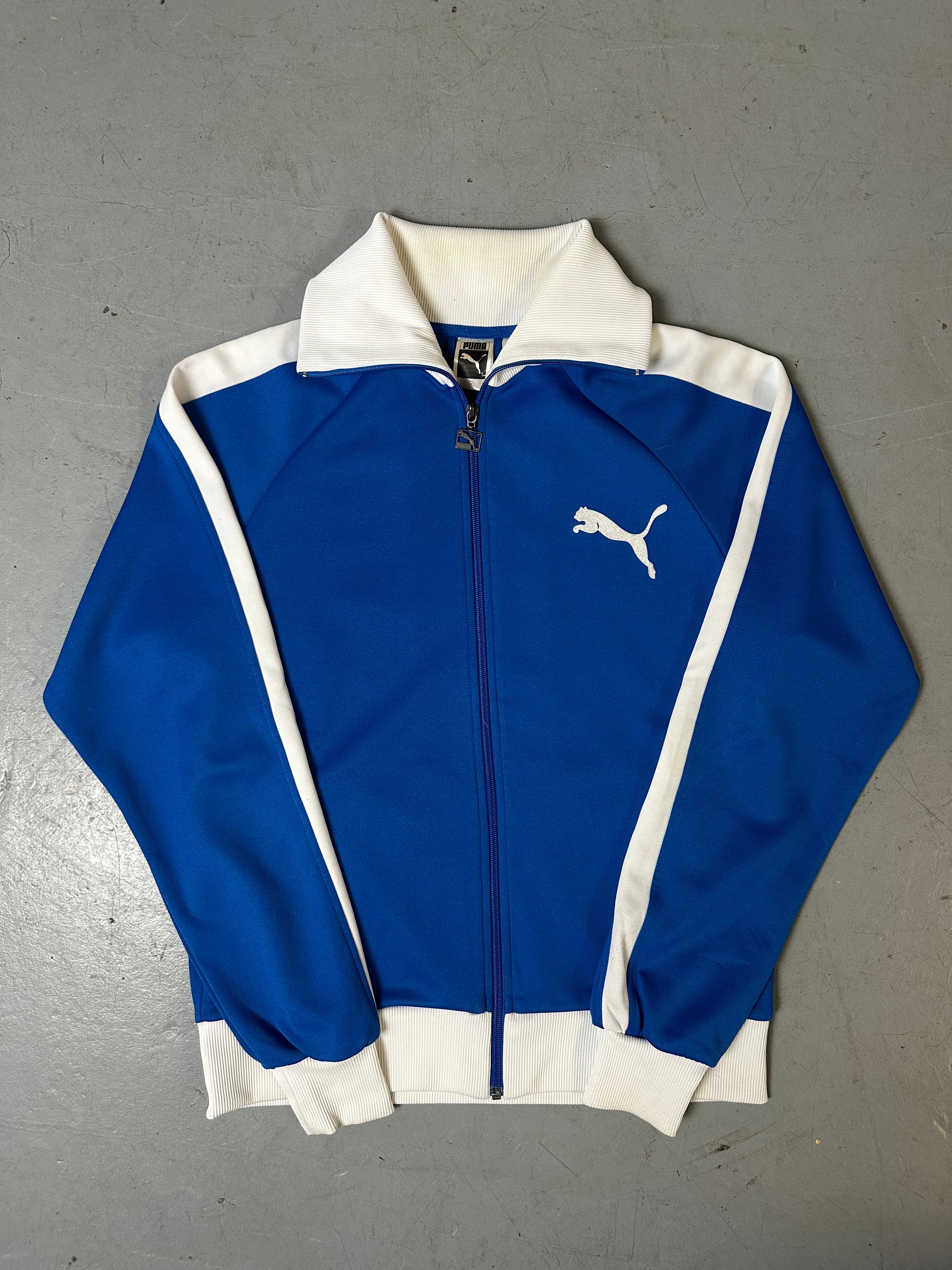 Ein Blau weißes Set von Puma bestehend aus Trackjacke und Trackpants in M/L