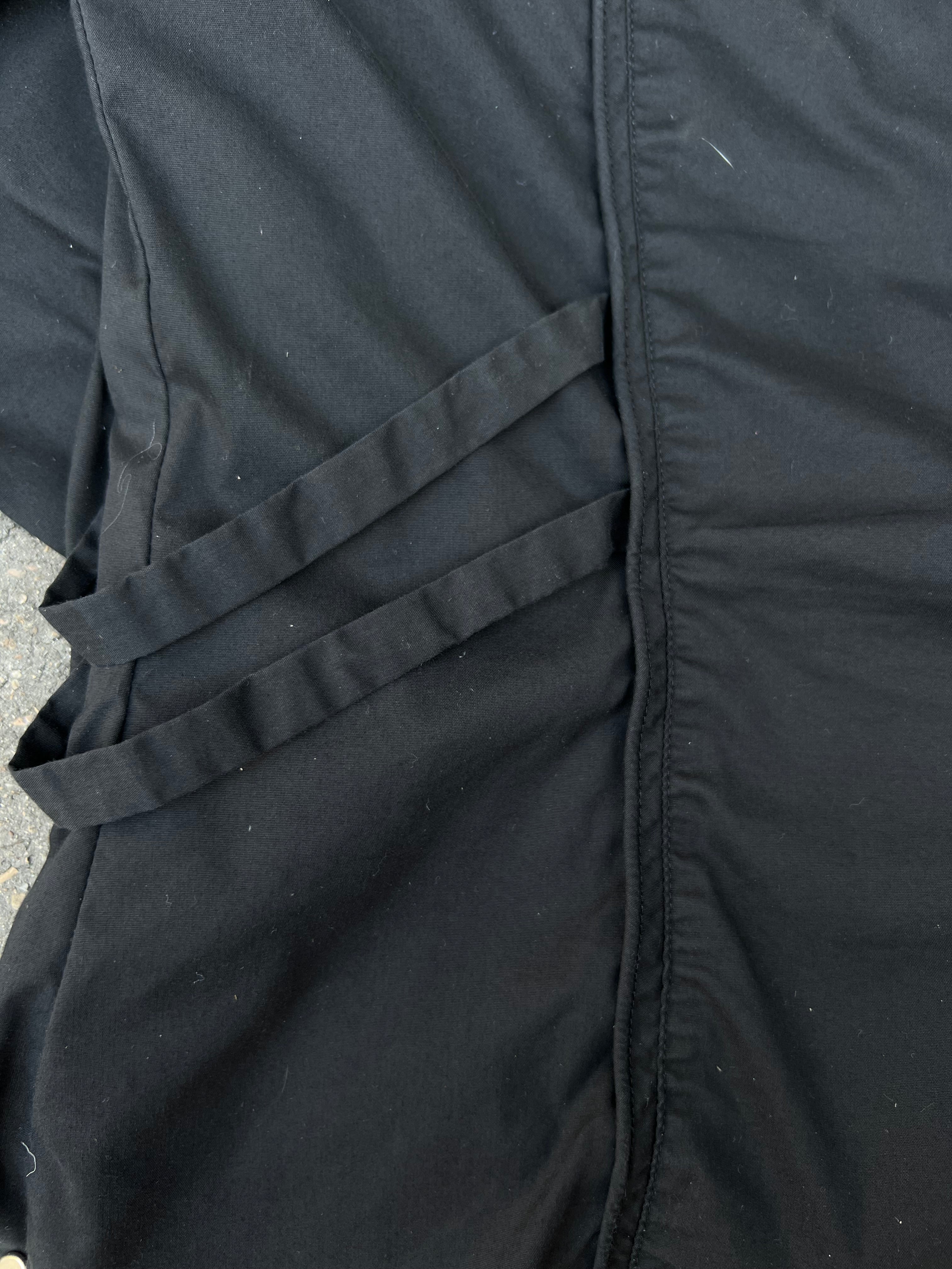 Eine schwarze Bluse von Diego Reiga in S mit Rüschen