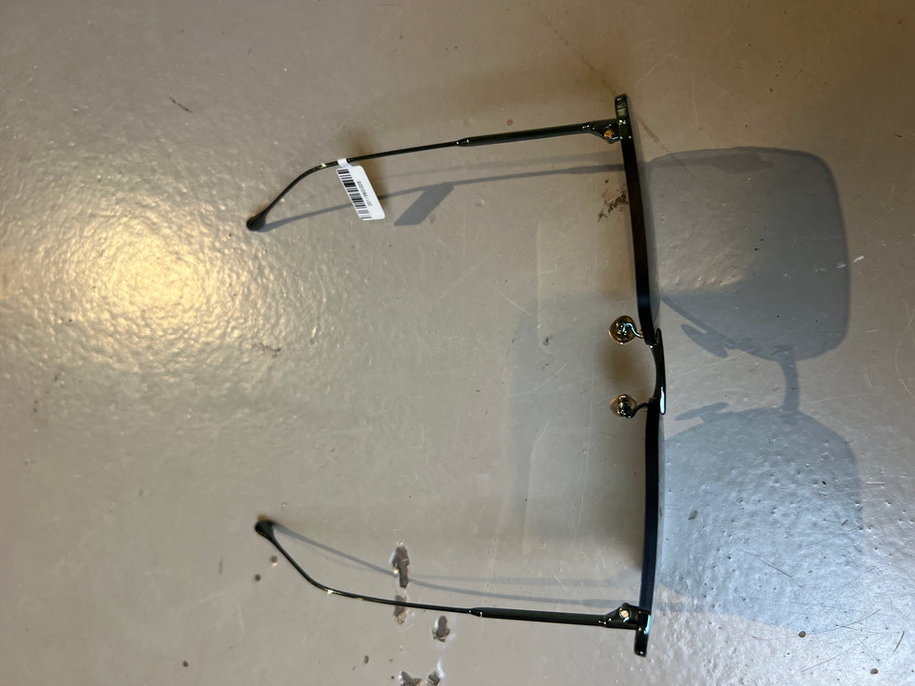 Produktbild der Isabel Marant Dark Green Sunglasses von oben vor grauem Hintergrund.