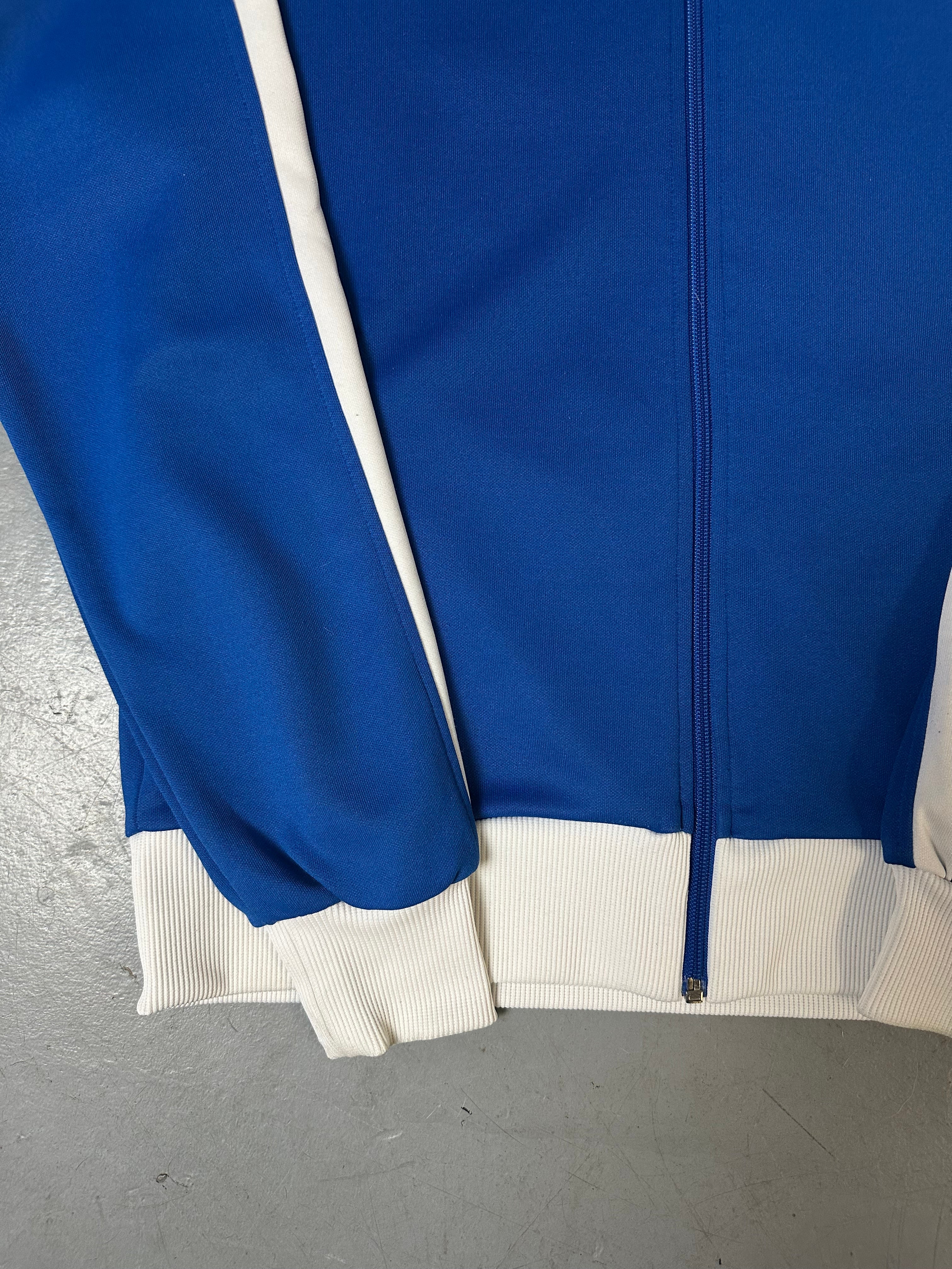 Ein Blau weißes Set von Puma bestehend aus Trackjacke und Trackpants in M/L
