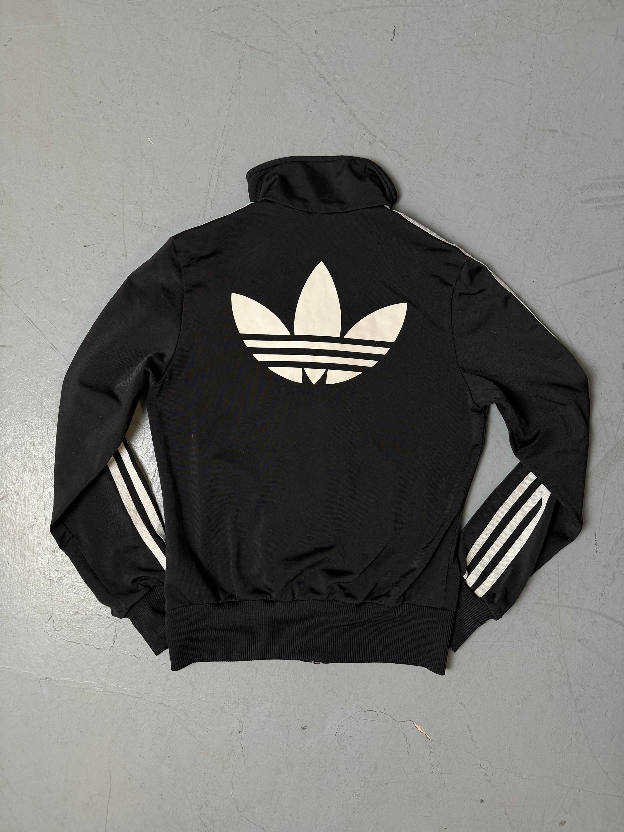 Eine schwarze Adidas Firebird Track Jacke mit weißen Streifen XS 