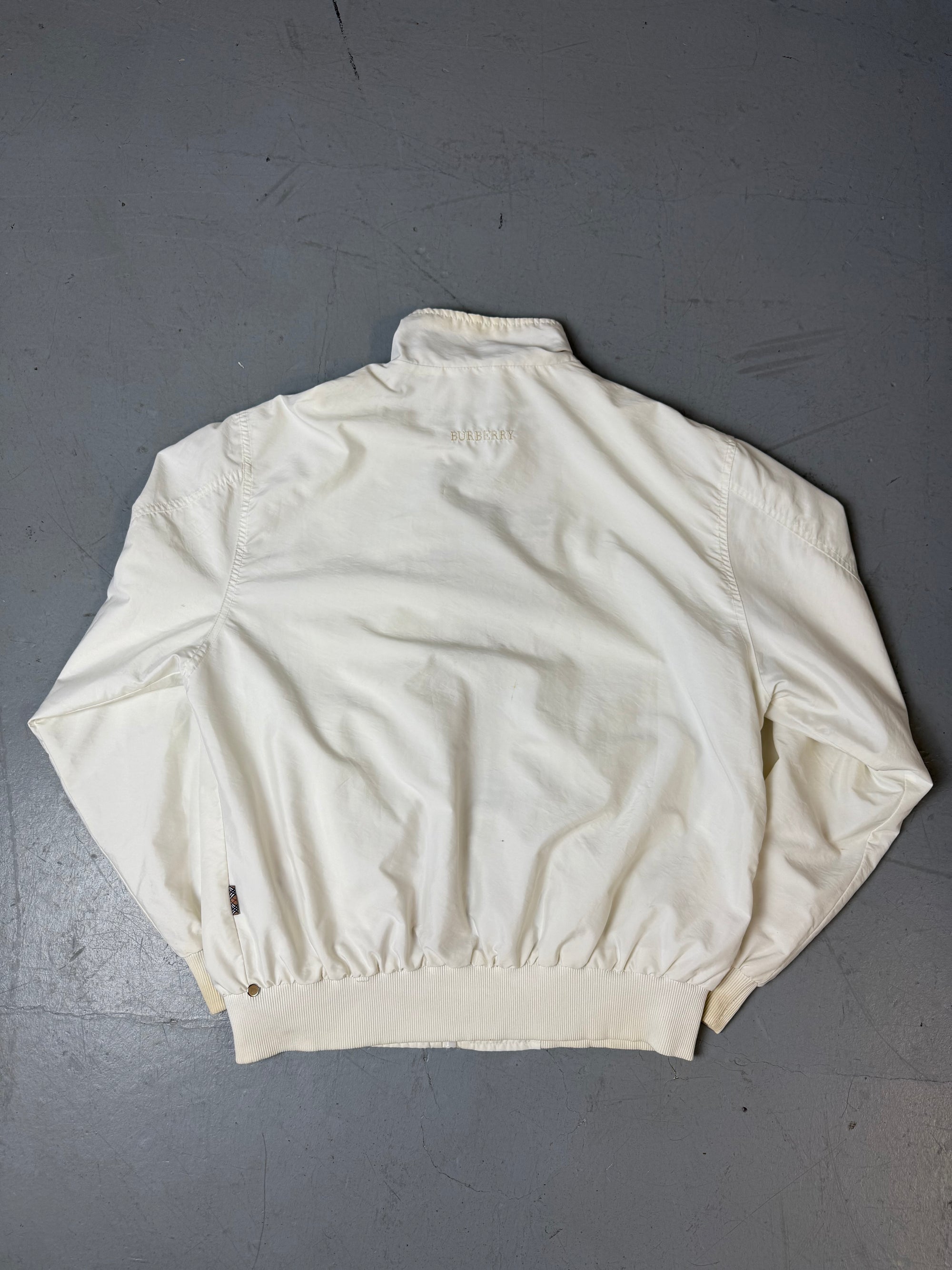Eine weiße Burberry Regenjacke in L