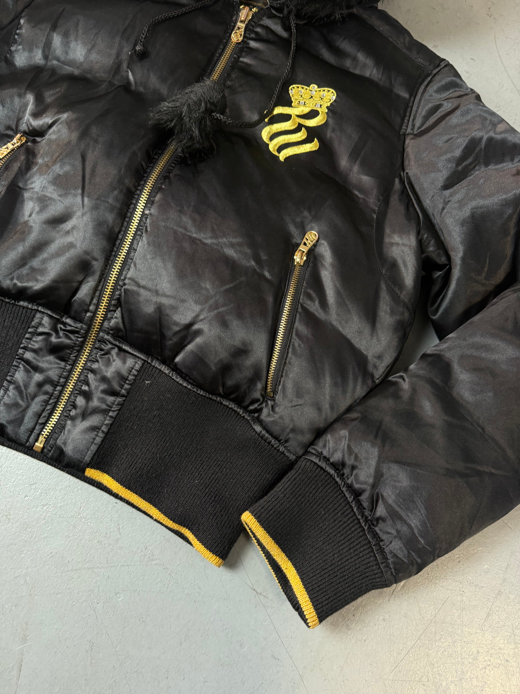 Eine schwarz golde Winterjacke von Rocawear mit Gold Details und fur hood 