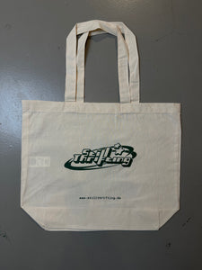 Produktbild von Still Thrifting Jute Bag auf grauem Boden.