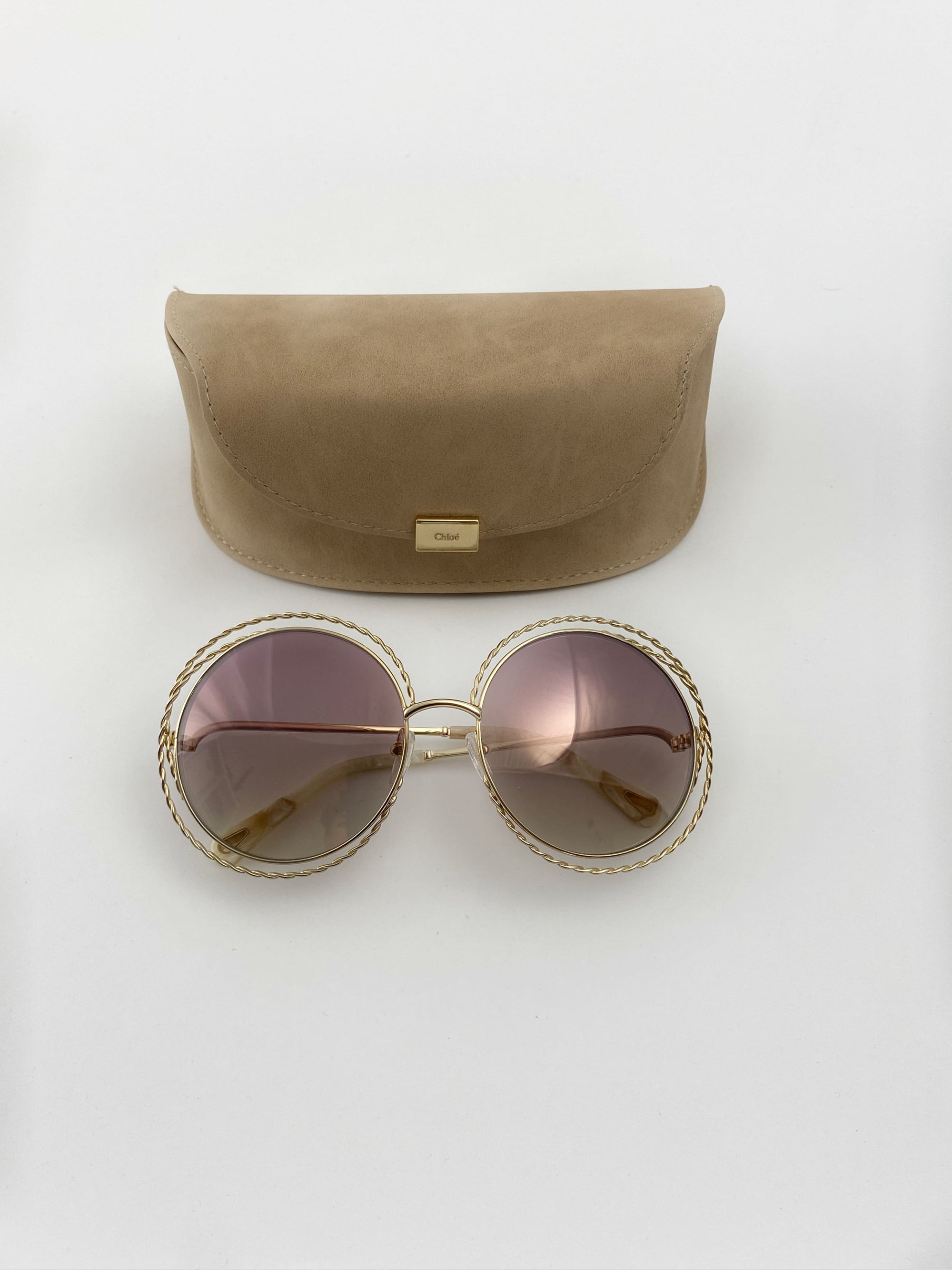 Produktbild der Chloé Sunglasses Nickel gold chains CE114ST 810 sunglasses von oben vor weißem Hintergrund.